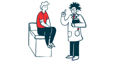 A doctor holding a clipboard talks with a patient sitting on an examining table.