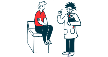 A doctor holding a clipboard talks with a patient sitting on an examining table.