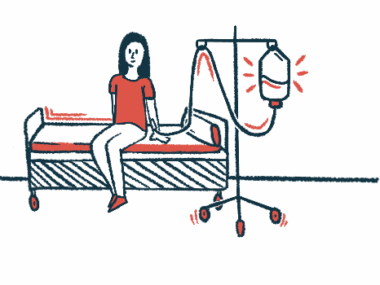 A person sits on a hospital bed while receiving an intravenous, or into-the-vein, infusion.