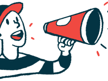 A person wearing a baseball cap speaks using a megaphone.