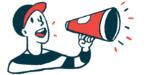 A person wearing a baseball cap speaks using a megaphone.