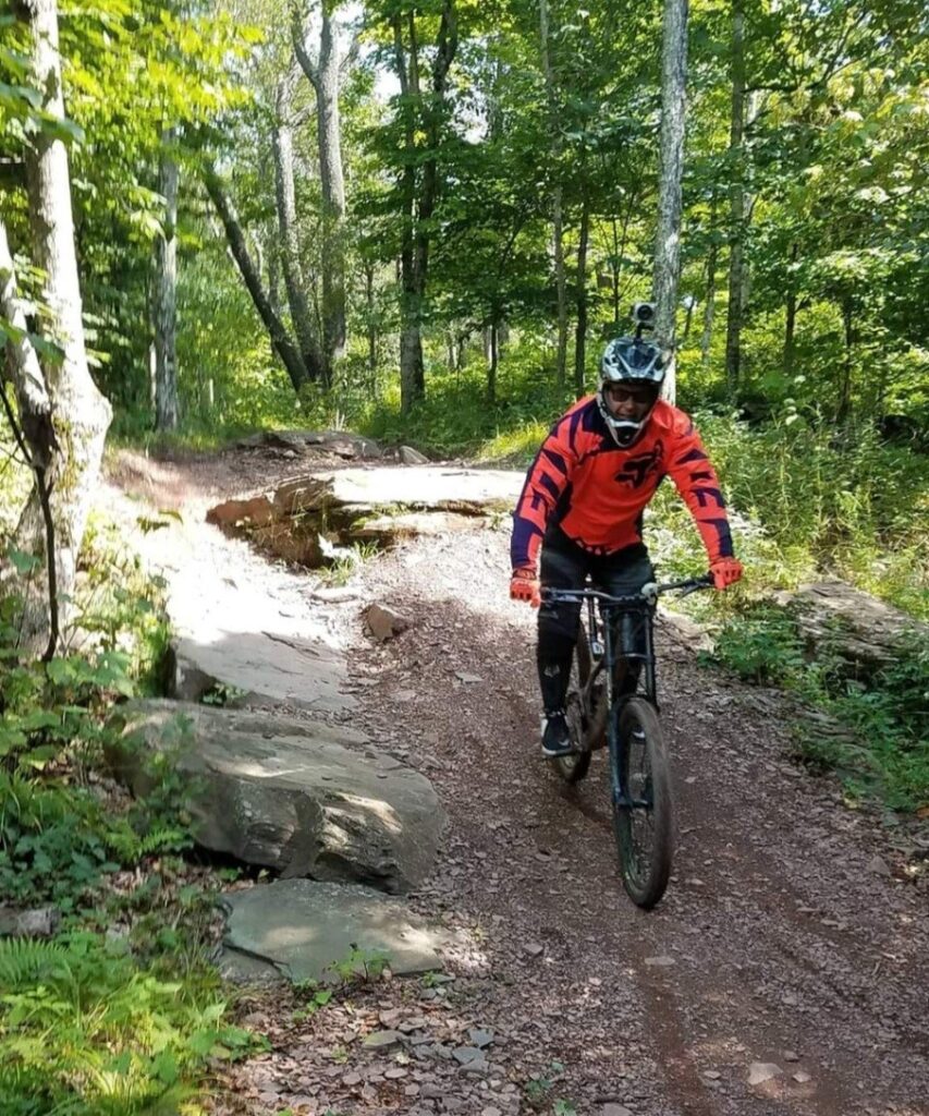 Jason on his bike on a trail